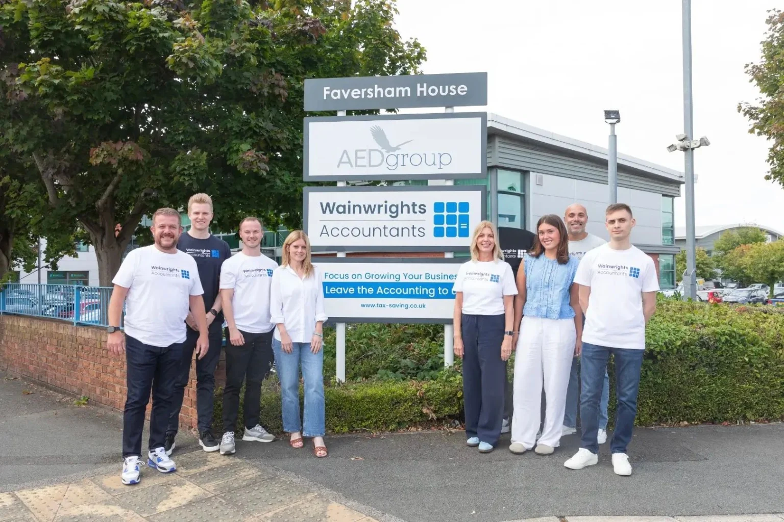 The Wainwrights Accountants team outside Faversham House in Bromborough