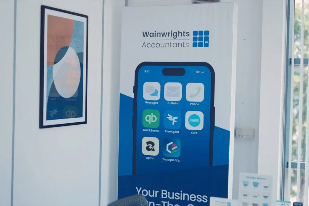 A Wainwrights Accountants banner showing a phone with QuickBooks, FreeAgent, Xero, Apron and Engager.app icons
