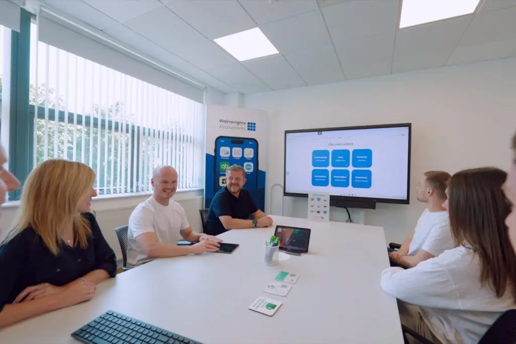Members of the Wainwrights Accountants team in a meeting at the Bromborough office